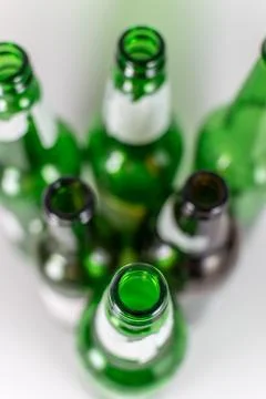 Top view of a pack of blurred  empty green and brownlongneck beer glass bottl Stock Photos