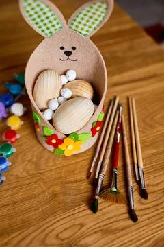 Top view pack of eggs with brush, paint and decorative elements 스톡 사진