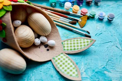 Top view pack of eggs with brush, paint and decorative elements 스톡 사진