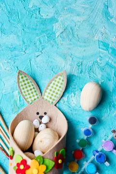 Top view pack of eggs with brush, paint and decorative elements 스톡 사진