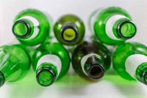 Top view of a pack of empty beer and wine green and brown glass bottles, with Stock Photos