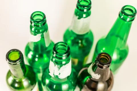 Top view of a pack of empty green and brown wine and beer glass bottles, with Stock Photos