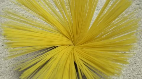 Top view A pack of uncooked spaghetti abstract background of spaghetti pasta rot Stock Footage 246234675