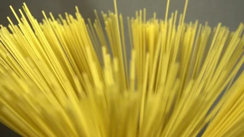 Top view A pack of uncooked spaghetti abstract background of spaghetti pasta rot Stock Footage 246234692
