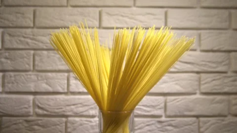 Top view A pack of uncooked spaghetti abstract background of spaghetti pasta rot Stock Footage 246234719