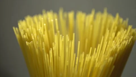 Top view A pack of uncooked spaghetti abstract background of spaghetti pasta rot Stock Footage 246234914