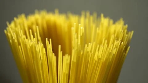 Top view A pack of uncooked spaghetti abstract background of spaghetti pasta rot Stock Footage 246234915