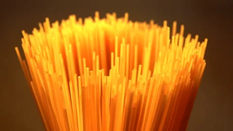 Top view A pack of uncooked spaghetti abstract background of spaghetti pasta rot Stock Footage 246235006