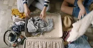 Top View Packing Vintage Suitcase In Spanish Villa Girls Planning Road Trip Red Stock Footage