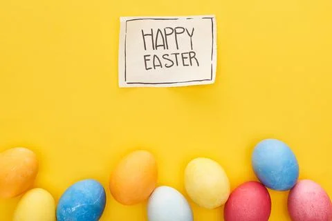 Top view painted eggs greeting Stock Photos