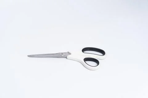 Top view of a pair of white color plastic scissors isolated on white backgrou Stock Photos