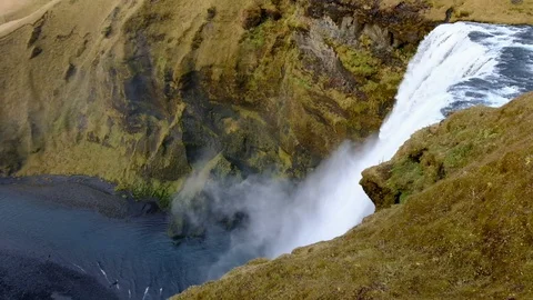 Top view pan camera Skogafoss powerfull waterfall in iceland Popular tourist Stock Footage 100765607