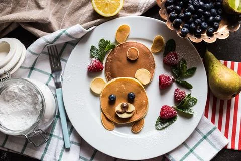 Top view on pancakes in the shape of a bear Foto stock
