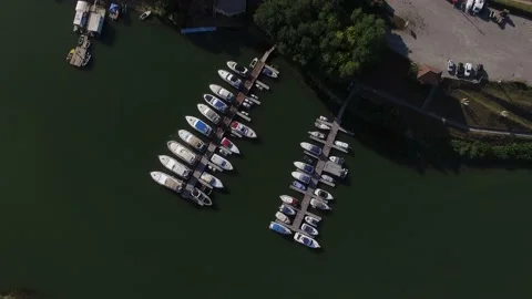 Top view panning of a luxury harbor on pier. Aerial shot Stock Footage 212331524