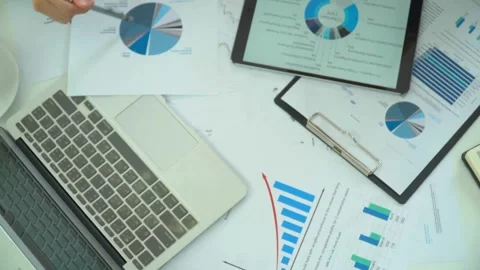 Top view paper of analyzing on business data with digital tablet at office .. Stock Footage 256740450