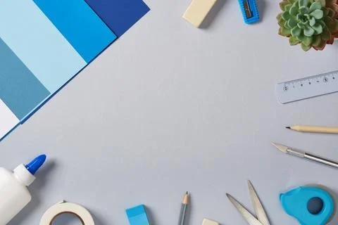 Top view of the paper crafts work table. Scissors, craft knife, pencil, glue, Stock Photos