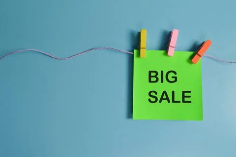 Top view of paper note written with BIG SALE isolated on blue background Stock Photos