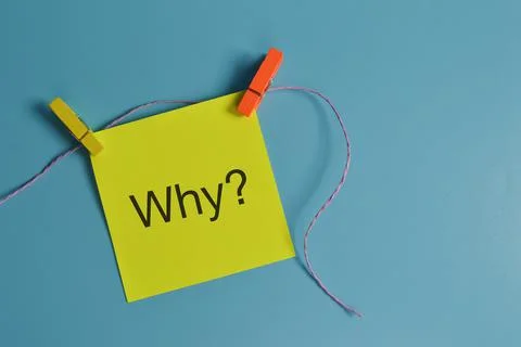 Top view of paper note written with question WHY? Stock Photos