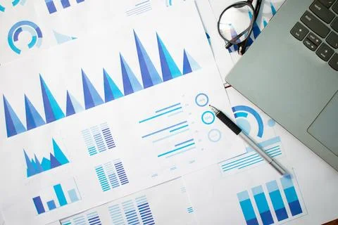 Top view paperwork with printed statistic chart. Stock Photos
