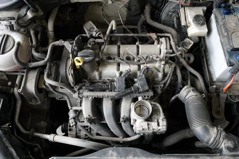 Top view of a partially disassembled engine of a modern car. Stock Photos