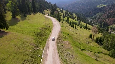 Top view of a passenger car that is driving on a mountain road in Georgia Stock Footage 168678071