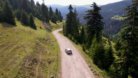 Top view of a passenger car that is driving on a mountain road in Georgia Stock Footage 168678429