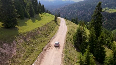 Top view of a passenger car that is driving on a mountain road in Georgia Stock Footage 168678471