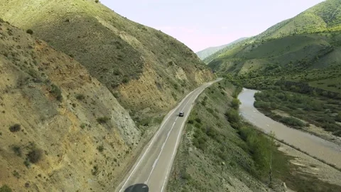 Top view of a passenger car that is driving on a mountain road in Turkey Stock Footage 194837075