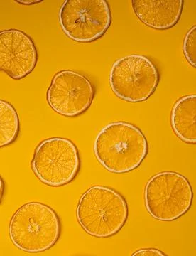 Top view of pattern of dried orange slices lying Stock Photos