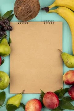 Top view of pattern of fruits as coconut pear peach grape banana apple arou.. Stock Photos