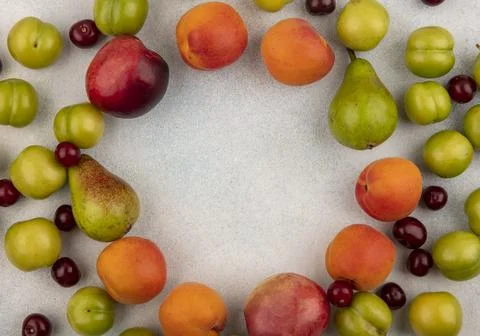 Top view of pattern of fruits as plum peach and pear cherry on white backgr.. Stock Photos