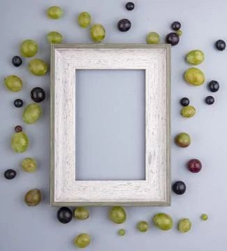 Top view of pattern of grape berries around frame on gray background with c.. Stock Photos