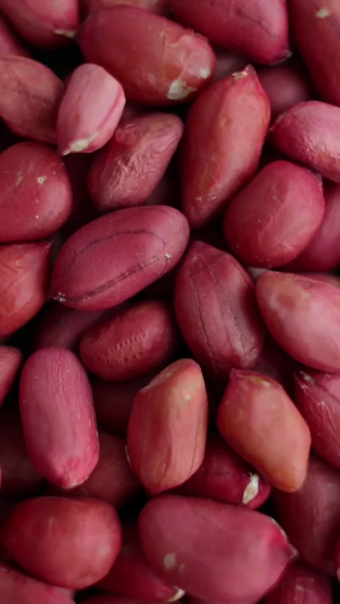 Top view: Peanuts heap rotating with close up shot. Vertical video. Stock Footage 271642762