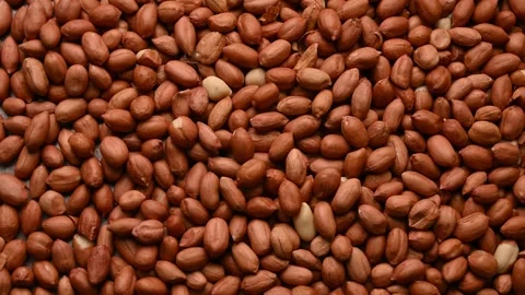 Top View of Peanuts Rotating on Textured Background – Food Footage Stock Footage 329347948