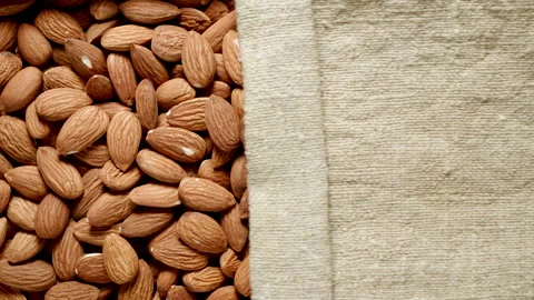 TOP VIEW: Peeled almonds under opening sackcloth 動画素材 171149413
