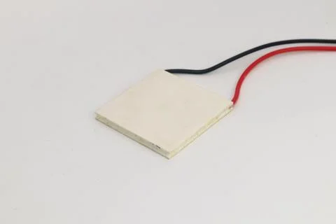 Top view of the Peltier temperature sensor with red and black wires. DIY mate Stock Photos