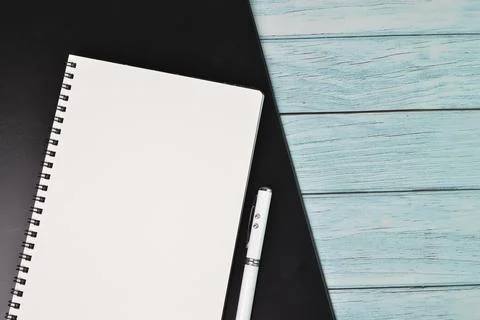 Top view of pen and notebook with copy space. Conceptual image Stock Photos