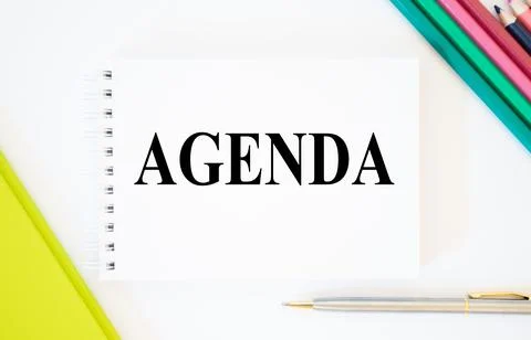 Top view of pen and notebook written with Agenda on white background Foto stock