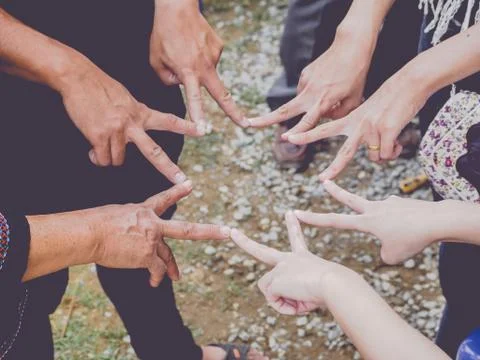 Top view of people doing star shape with fingers for showing teamwork Stock Photos