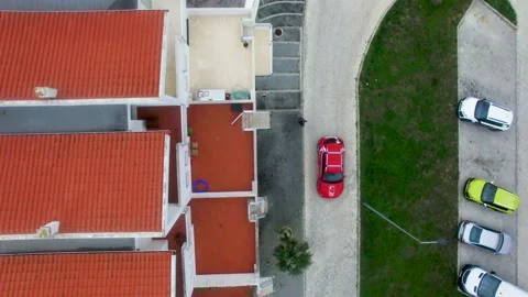 Top view of People getting out of Red car and walking inside building Stock Footage 156633812