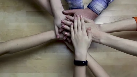 Top view of people putting their hands together. Stock Footage 135360751
