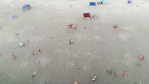 Top View of People On A Sandy Patch of a Beach - Dolly Forward Stock Footage 101824129