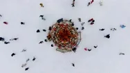 Top View Of People Skate On Ice Rink Around Christmas Tree In Park Stock Footage