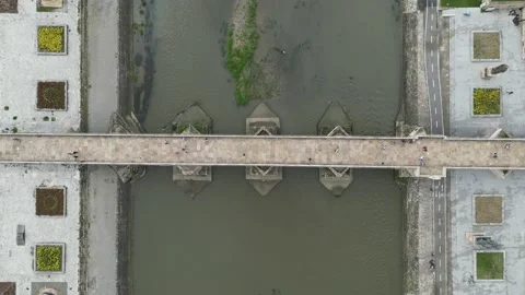 Top View of  the People Walking on a Bridge on the River Stock Footage 214312190