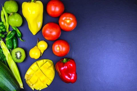Top view pepper walnut corn kiwi zucchini mango pear tomato. Stock-Fotos
