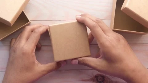 Top view of person open a empty small gift box 库存影片 168006740