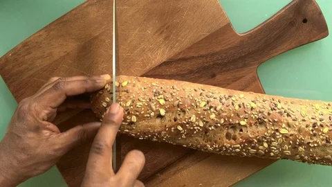Top view person slicing bread on wooden board - 15s 스톡 동영상 127942863