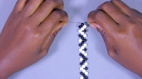 Top view of a person teaching how to  make wrist watch Stock Footage 202154527