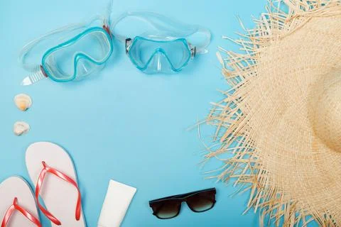 Top view photo of sunscreen diving mask, sneaker, alarm clock, seashells, cam Stock Photos