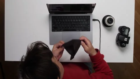 Top view Photographer finding empty wallet after downloading photos to laptop Stock Footage 311202406